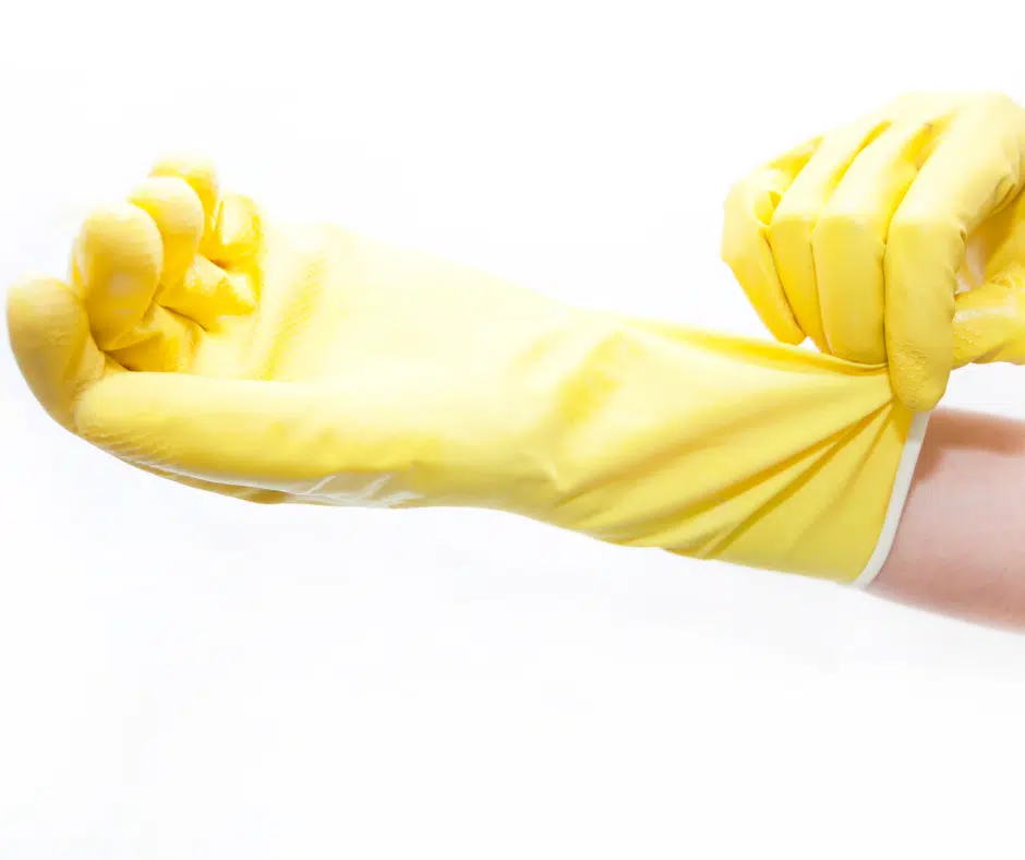 removing pet hair with rubber gloves